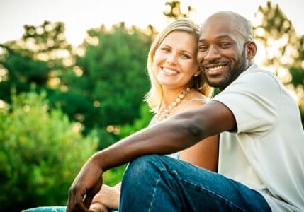 A man and woman sitting next to each other.