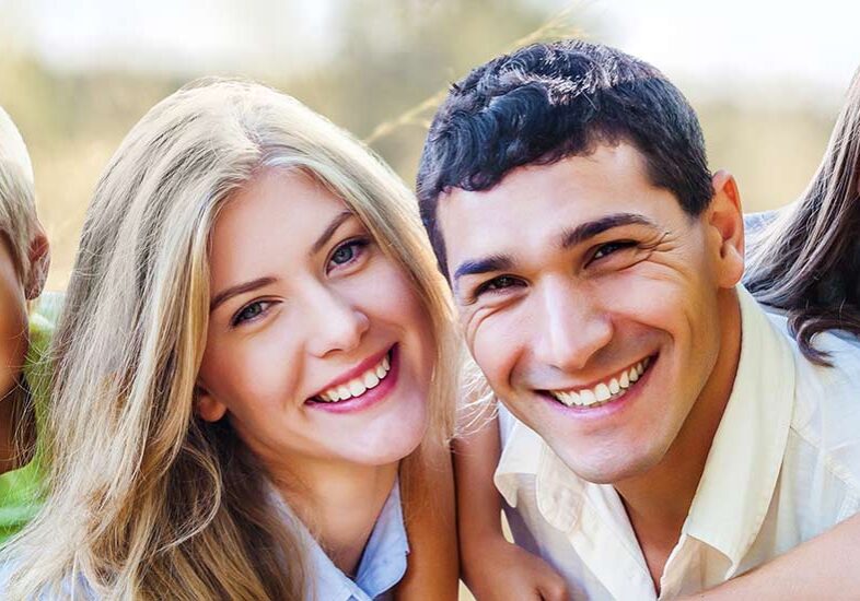 A man and woman smiling for the camera.