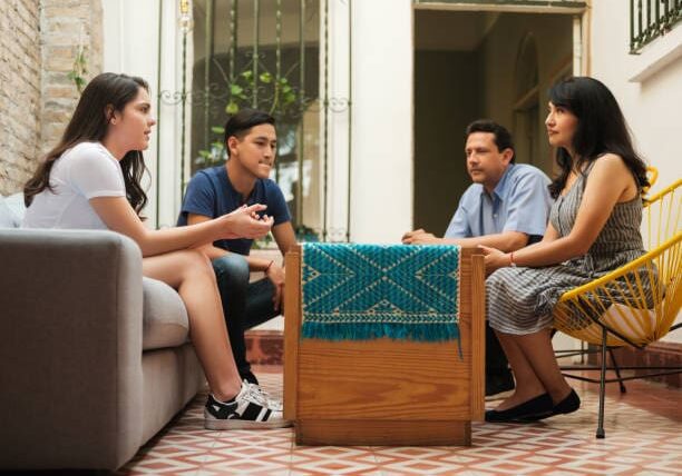 A group of people sitting around a table